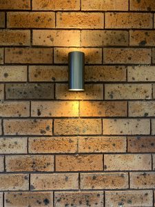 Outdoor LED light on a brick wall.